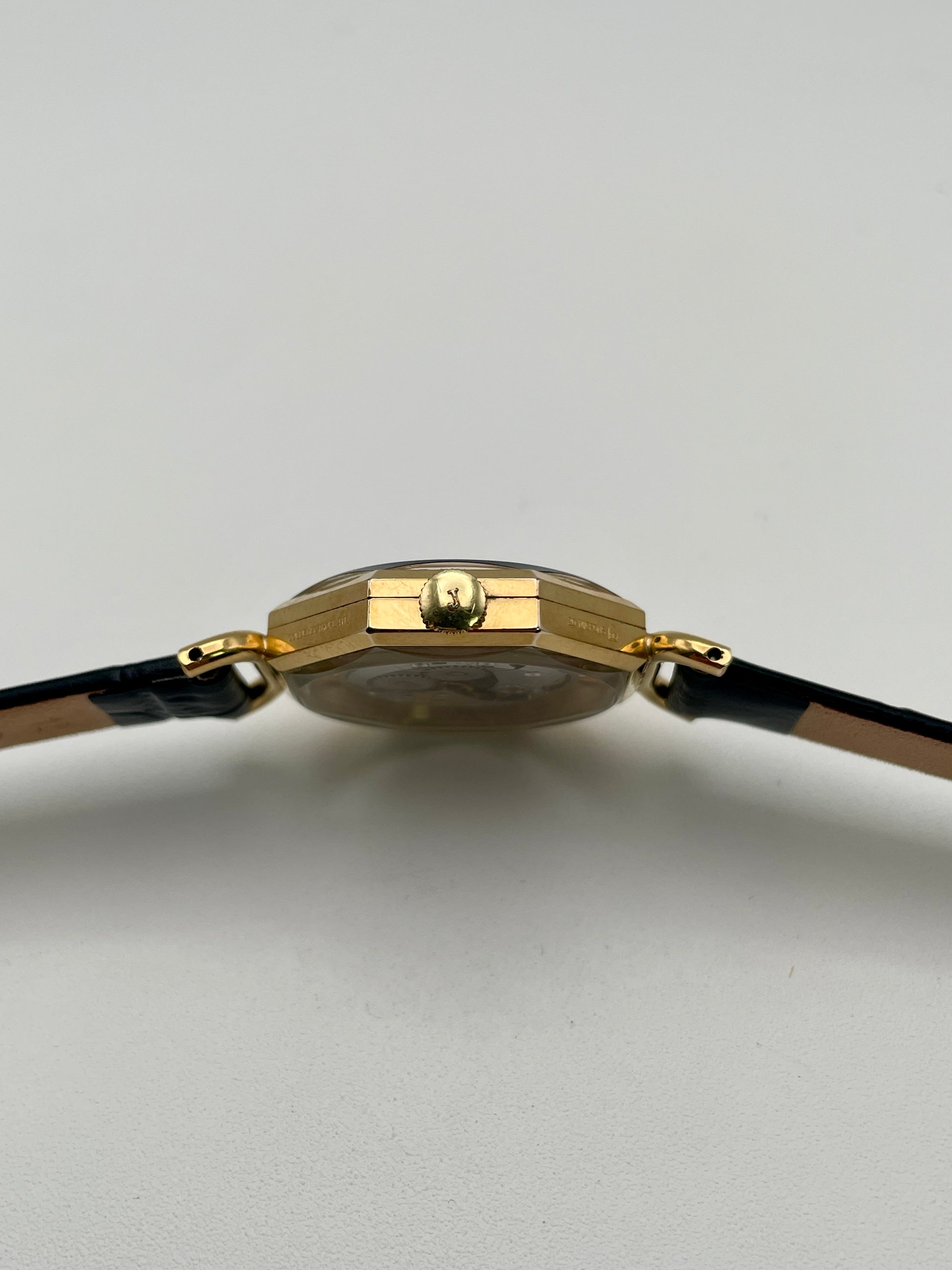Close-up of the crown and case thickness of the Juvenia Octagion watch

