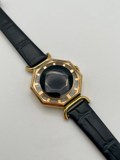 Diagonal view from left showing faceted crystal and octagonal case of Juvenia Octagion watch
