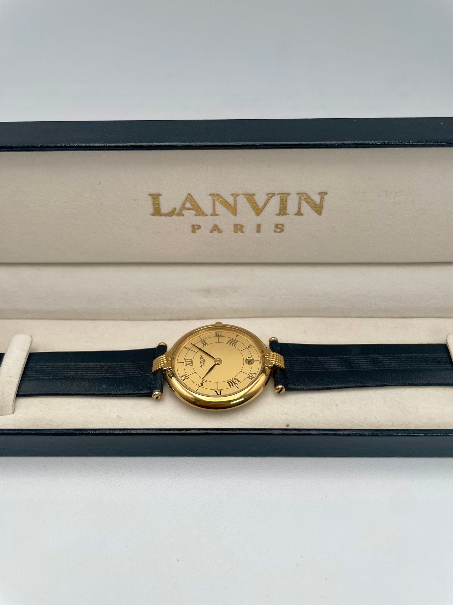 Lanvin Paris Vintage Ladies Watch in gold-tone case with black leather strap, main view in box