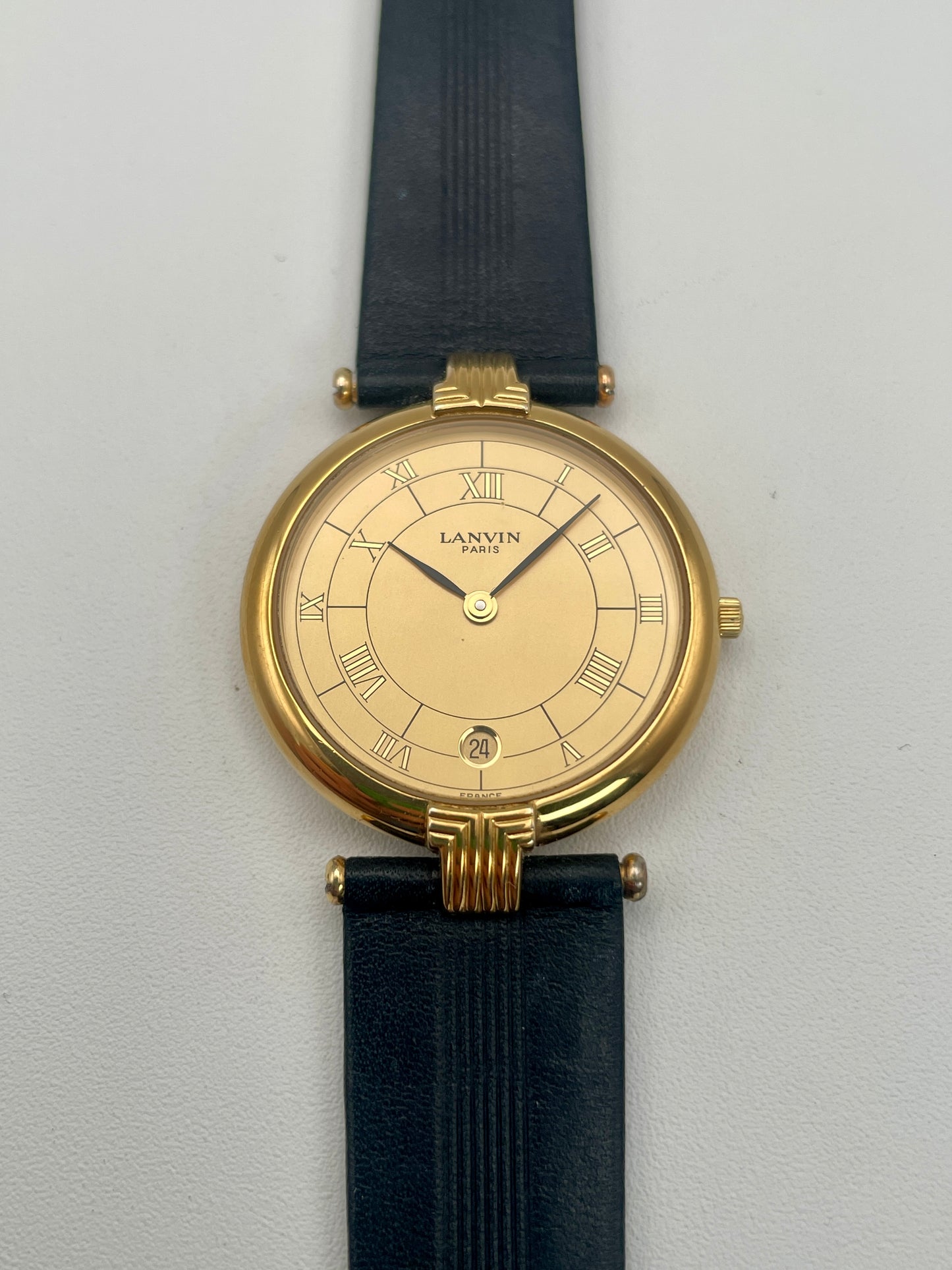 Front view of Lanvin Paris Vintage Watch, featuring Roman numeral dial and gold case
