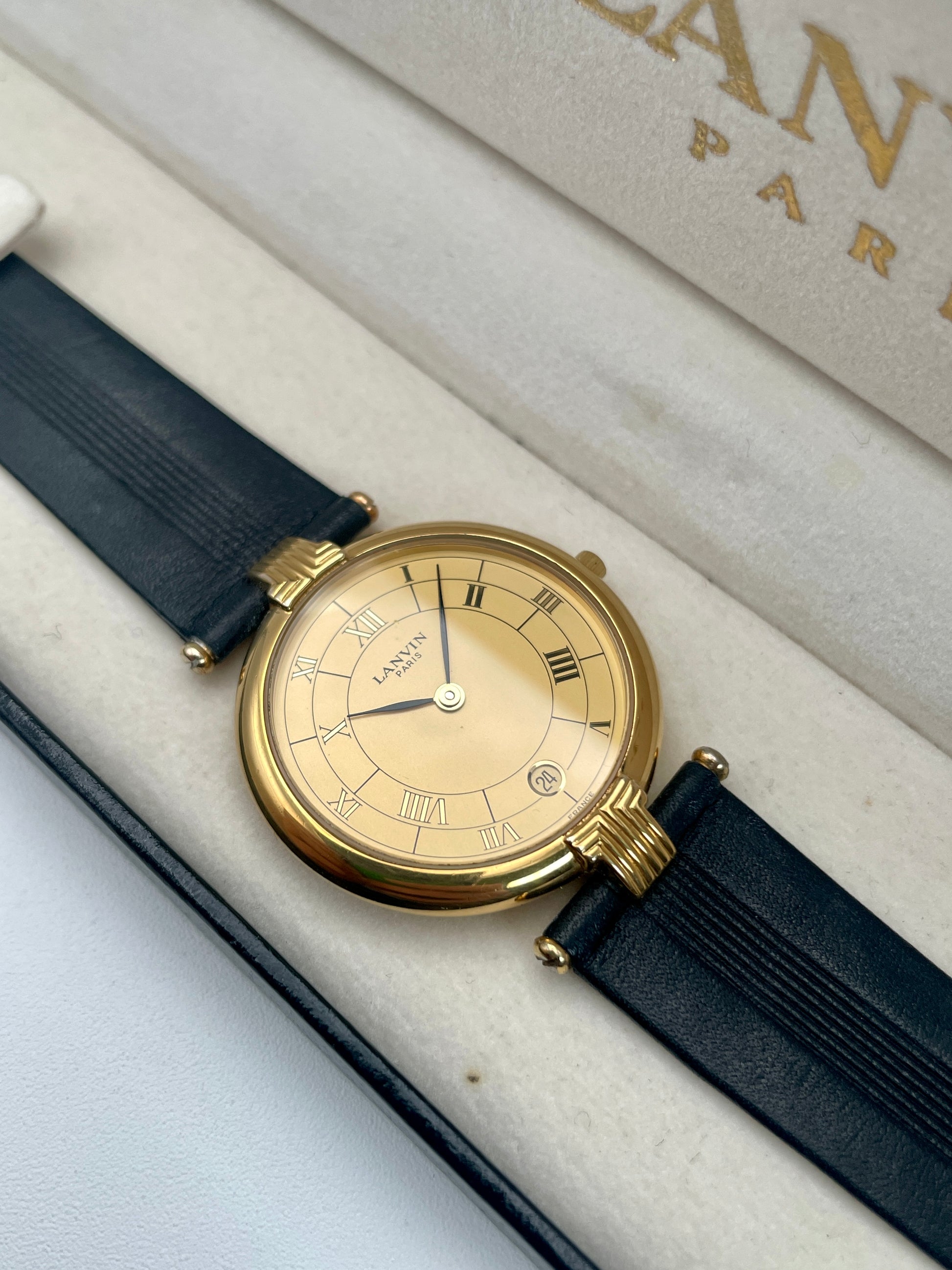 Lanvin Paris Vintage Ladies Watch in gold-tone case with black leather strap, main view in box
