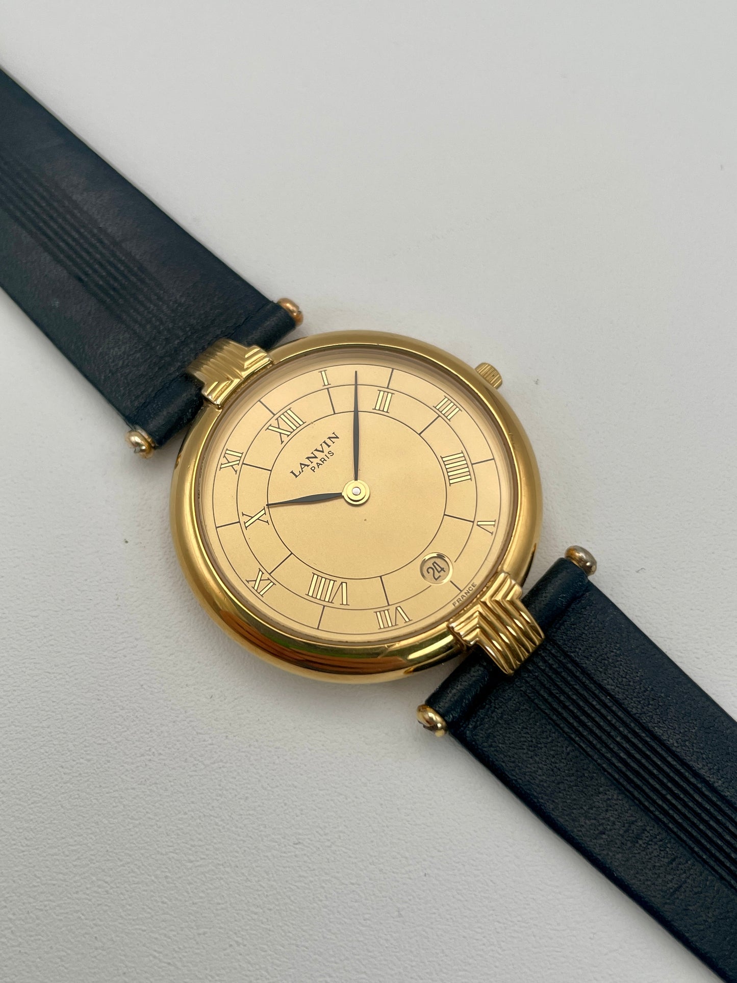 Main view of Lanvin Paris Vintage Watch, featuring Roman numeral dial and gold case
