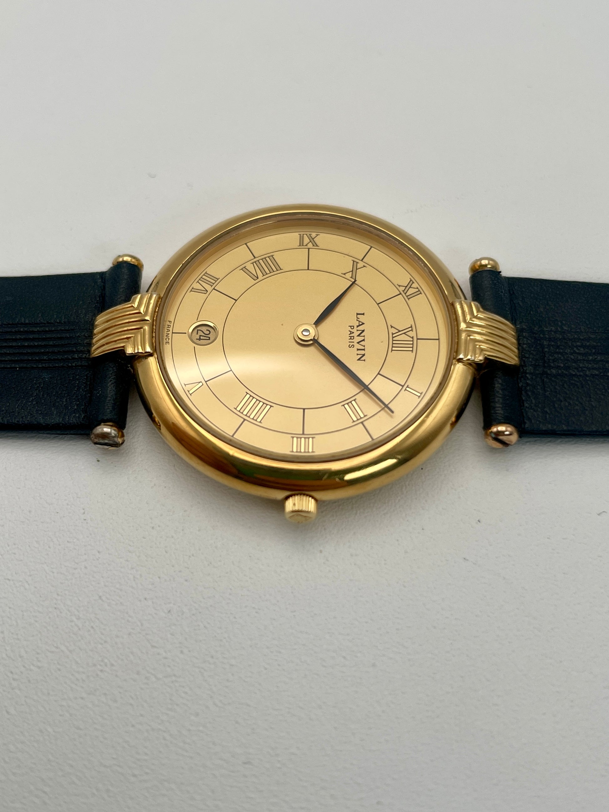 Side view of the thin gold-tone case of the Lanvin Paris Vintage Watch
