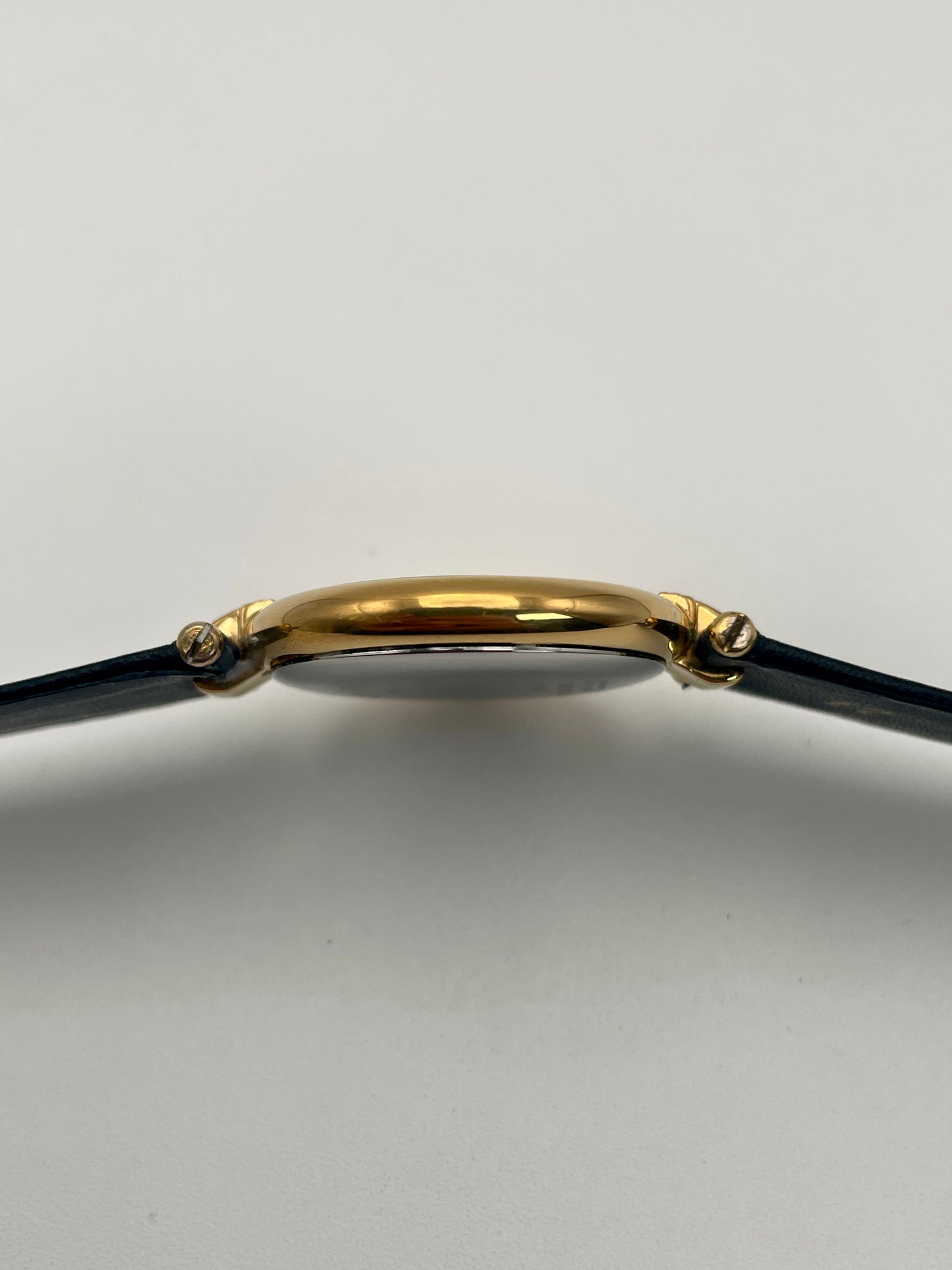 Side view of the thin gold-tone case of the Lanvin Paris Vintage Watch
