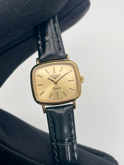 Close-up view of Longines 6068.2 watch on black glove, highlighting the rectangular case and clean dial

