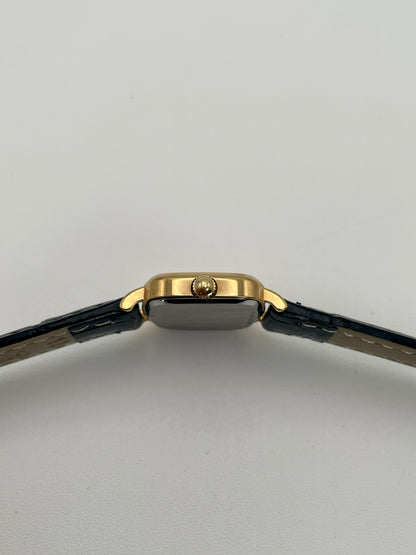 Side view with crown of Longines 6068.2 showcasing gold-tone crown and curved lugs
