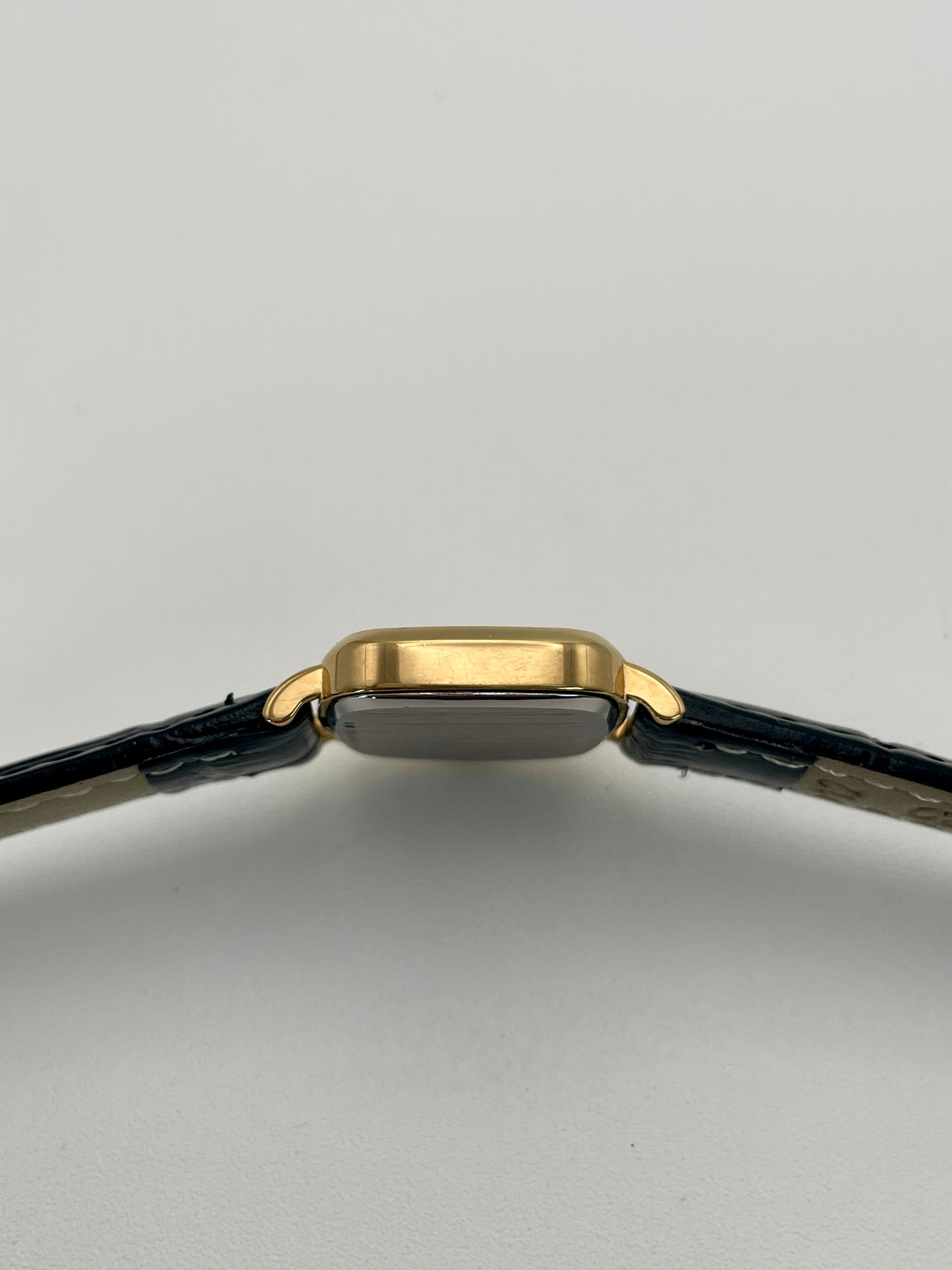 Side view of Longines 6068.2 highlighting the slim gold-tone case profile
