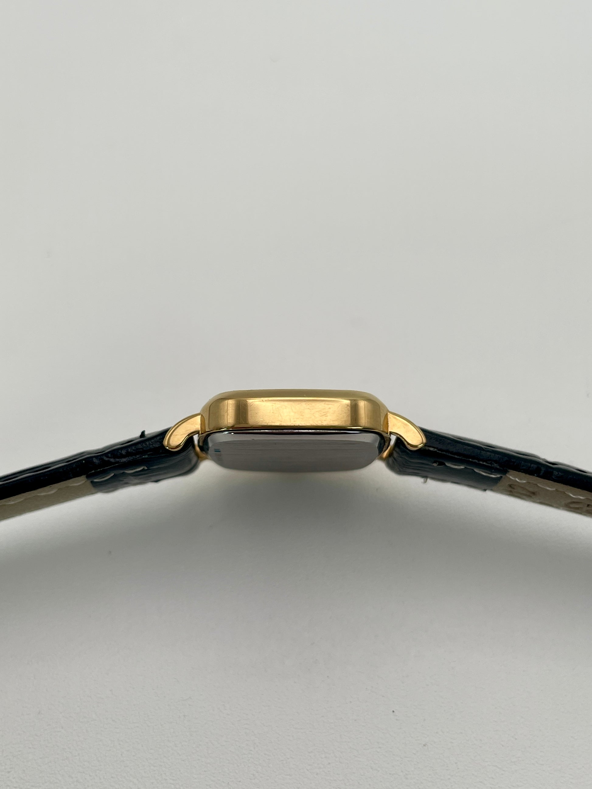 Side view of Longines 6068.2 highlighting the slim gold-tone case profile
