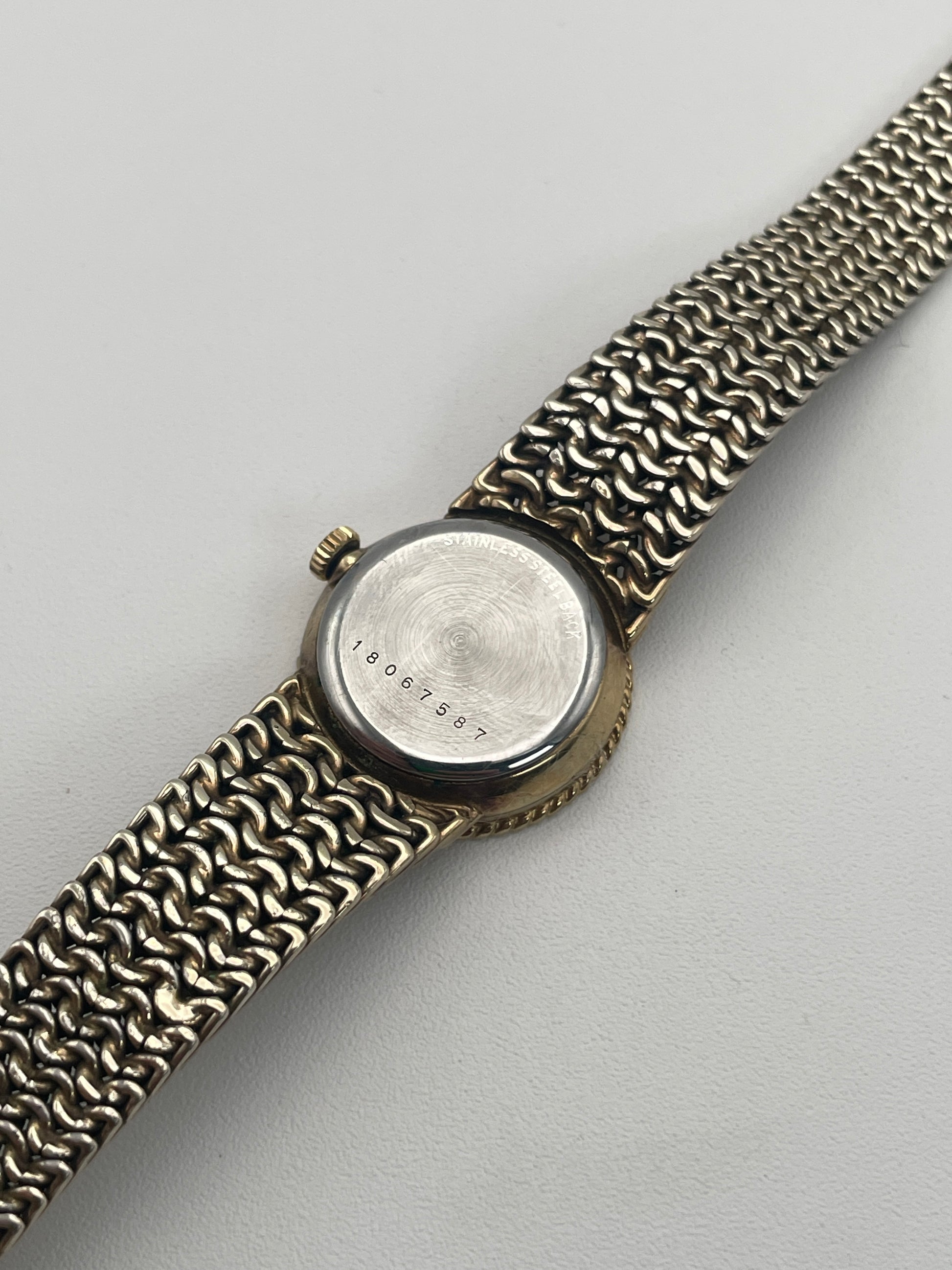 Caseback view of Longines Braided Bezel Vintage Ladies Watch with visible serial number.