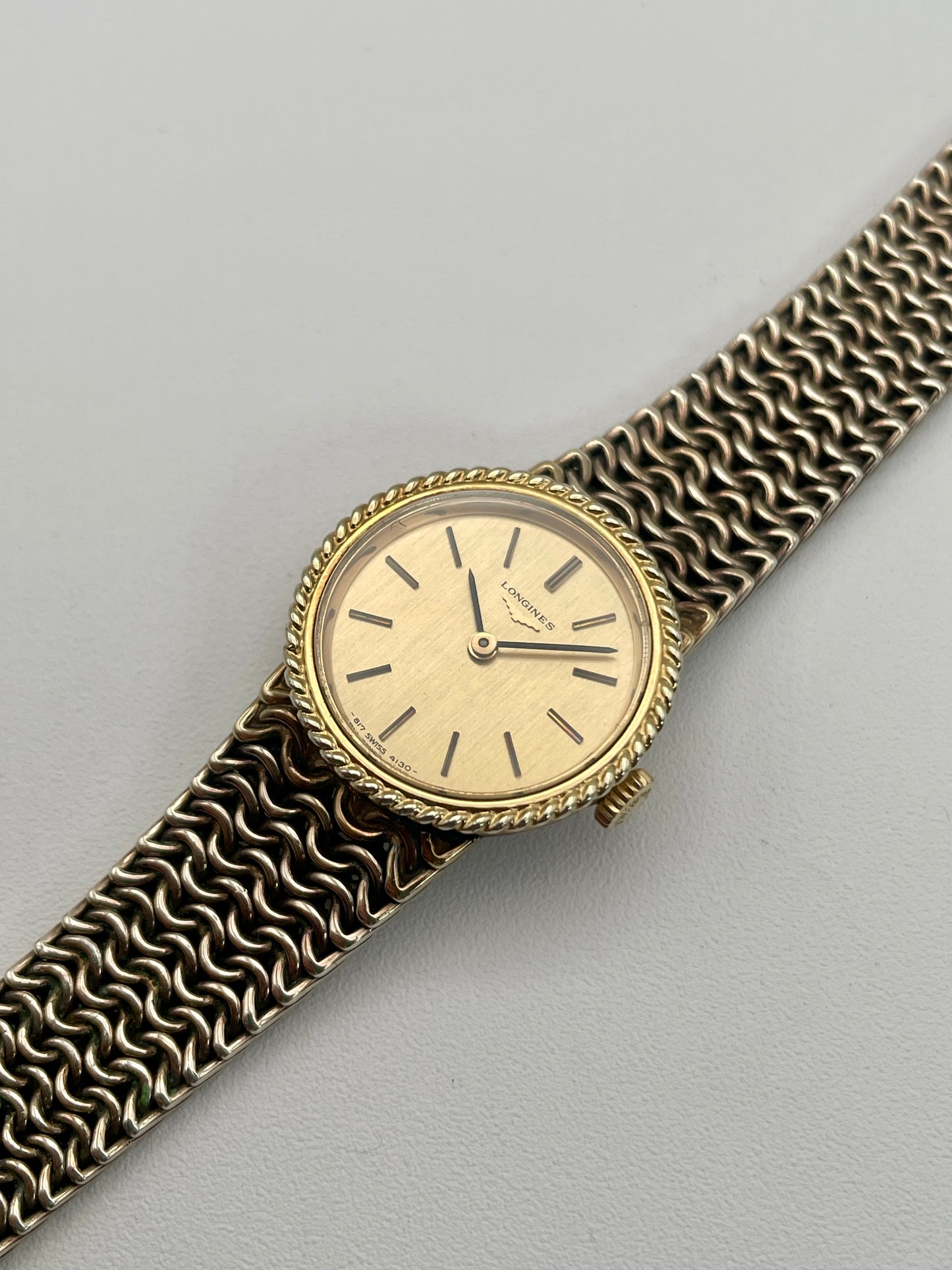 Diagonal view of Longines Braided Bezel Vintage Ladies Watch with integrated chainmail bracelet.