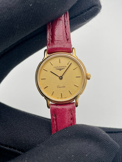Close-up view of the Longines L153.4 champagne dial with baton hour markers
