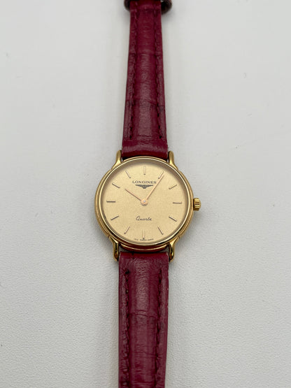Front view of Longines L153.4 Vintage Women's Watch in gold case with red leather strap
