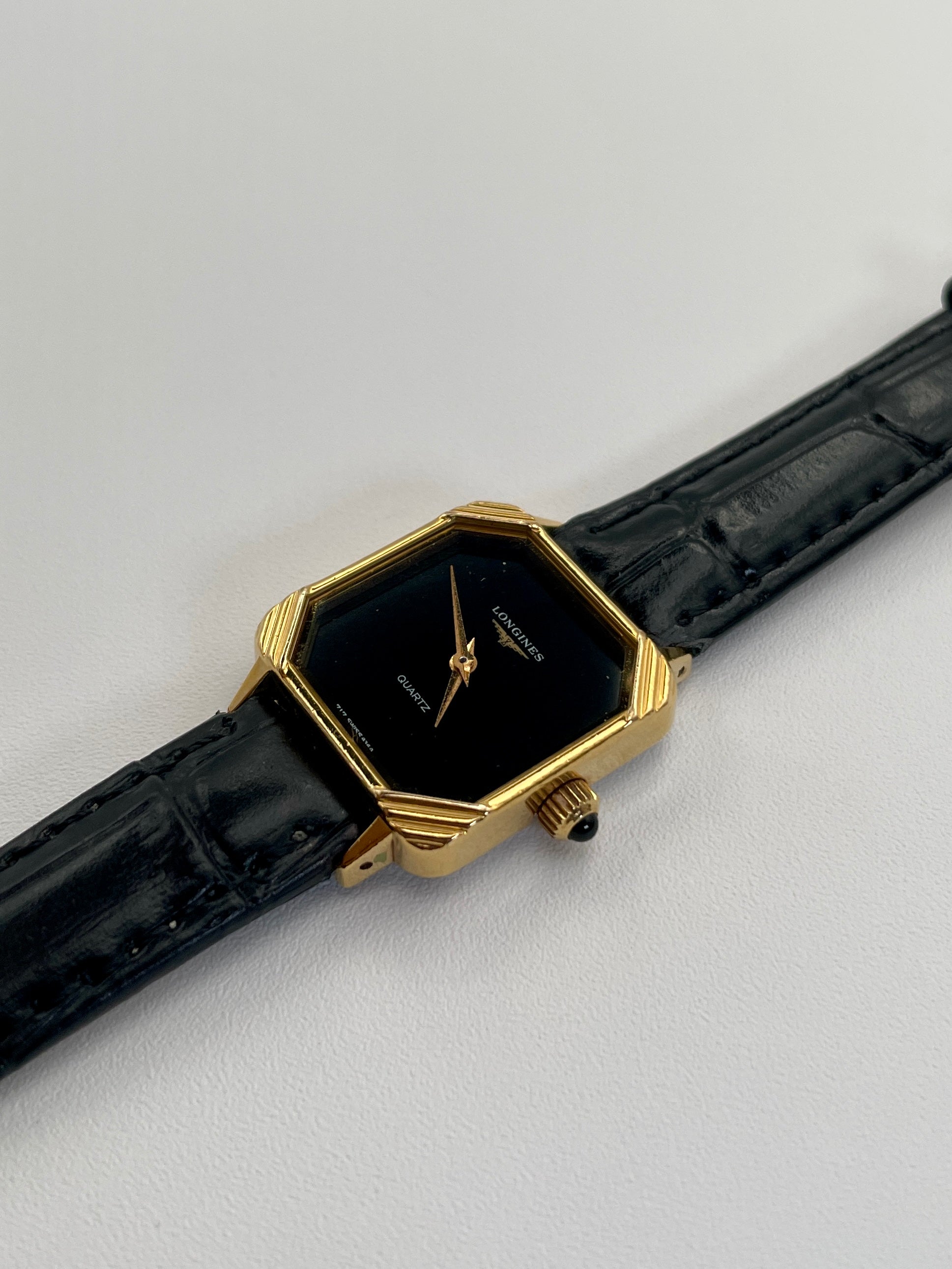 Side view of Longines Neo-Vintage Quartz watch with gold case and black leather strap.

