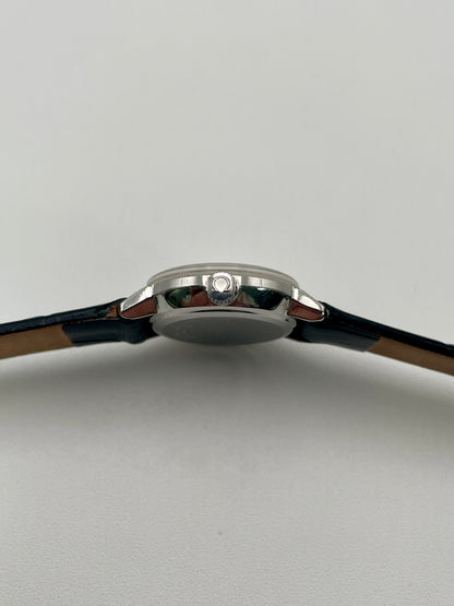 Side view of the Omega De Ville 515.007 vintage women's watch focusing on its polished stainless steel crown and case profile.