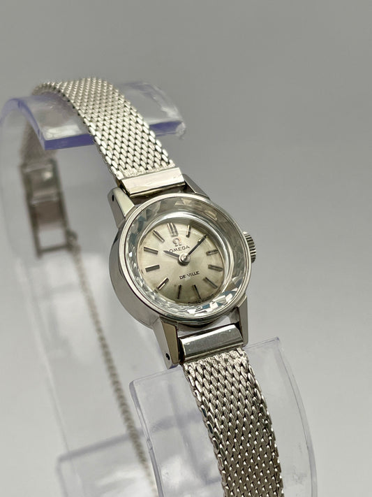 Omega De Ville watch with cut glass crystal, stainless steel case, and mesh bracelet, main view showcasing the unique crystal