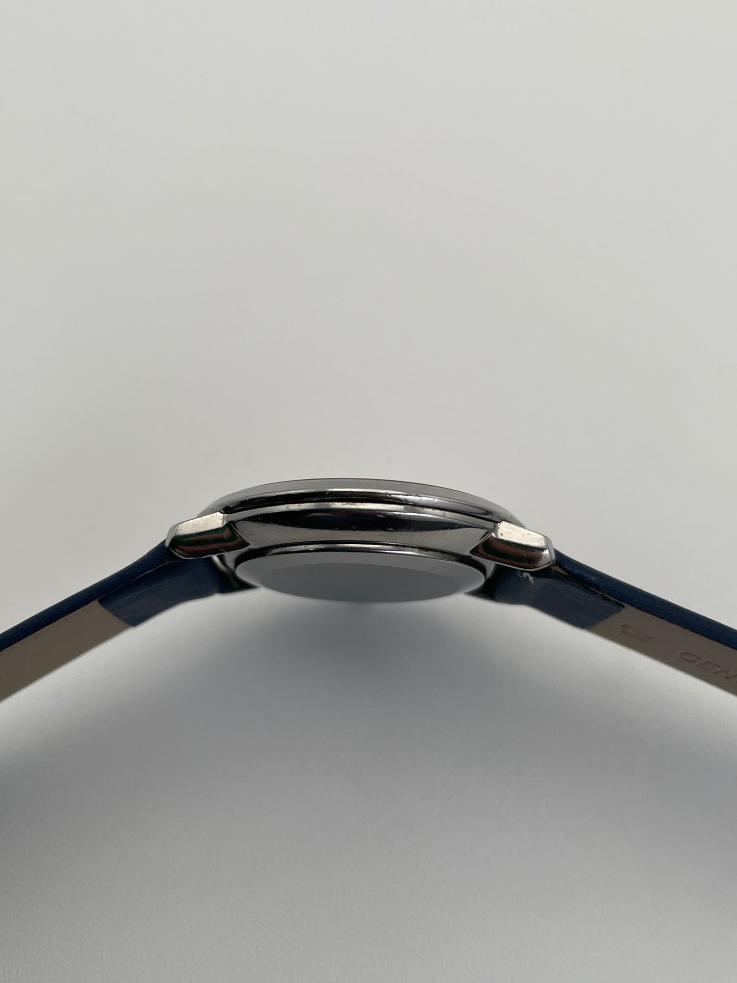 Angle side view of the Omega De Ville Ref 111.0107 watch highlighting its slim profile and distinctive spider dial.