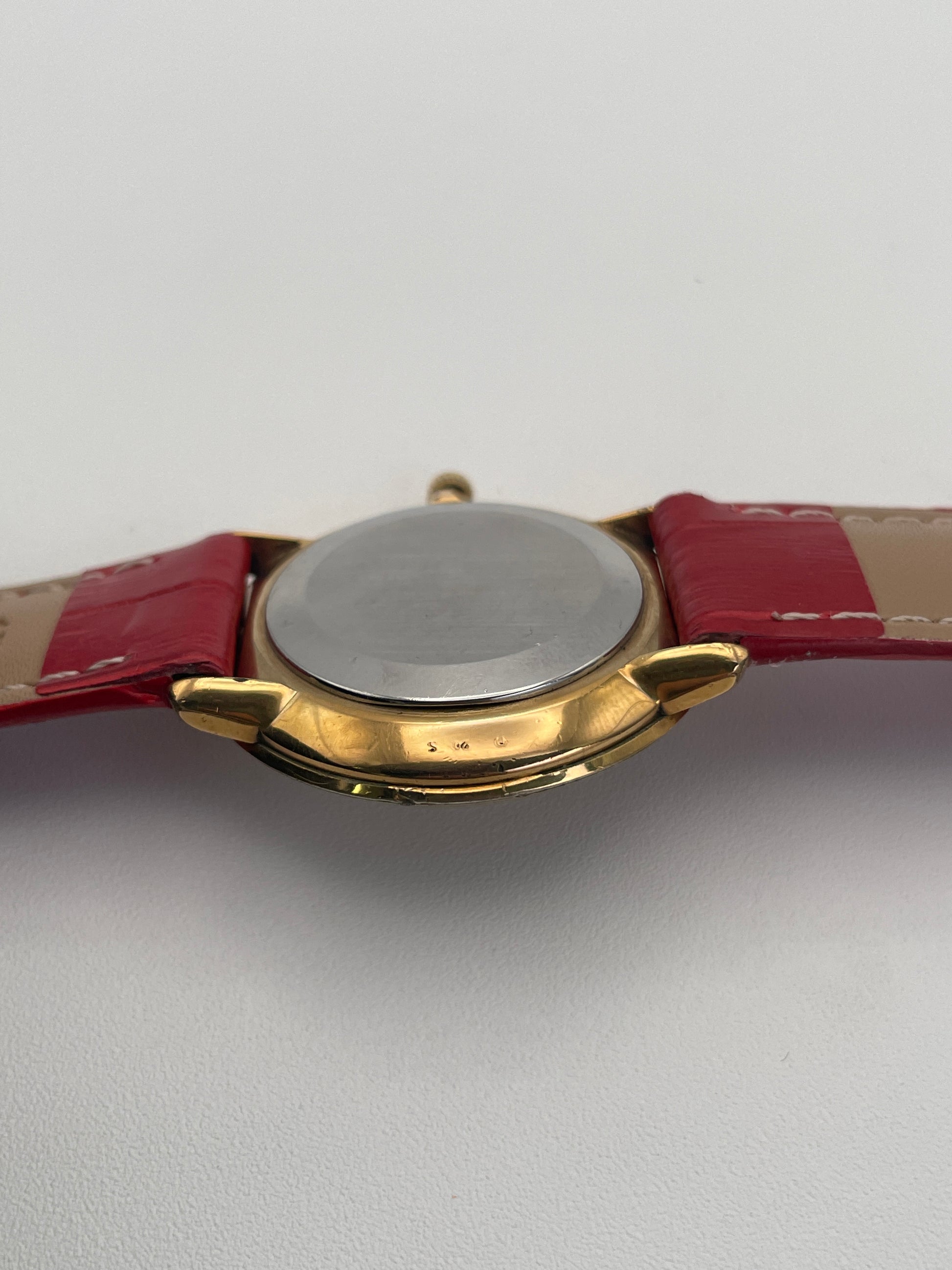 Omega De Ville Ref. 111.0144 gold watch, side view.