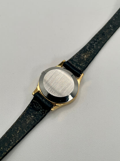 Close-up of the caseback of the Omega De Ville 1350 with brushed steel and serial engraving.