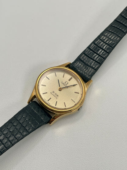 Diagonal angle showing the Omega De Ville 1350’s clean dial and polished gold-tone case.