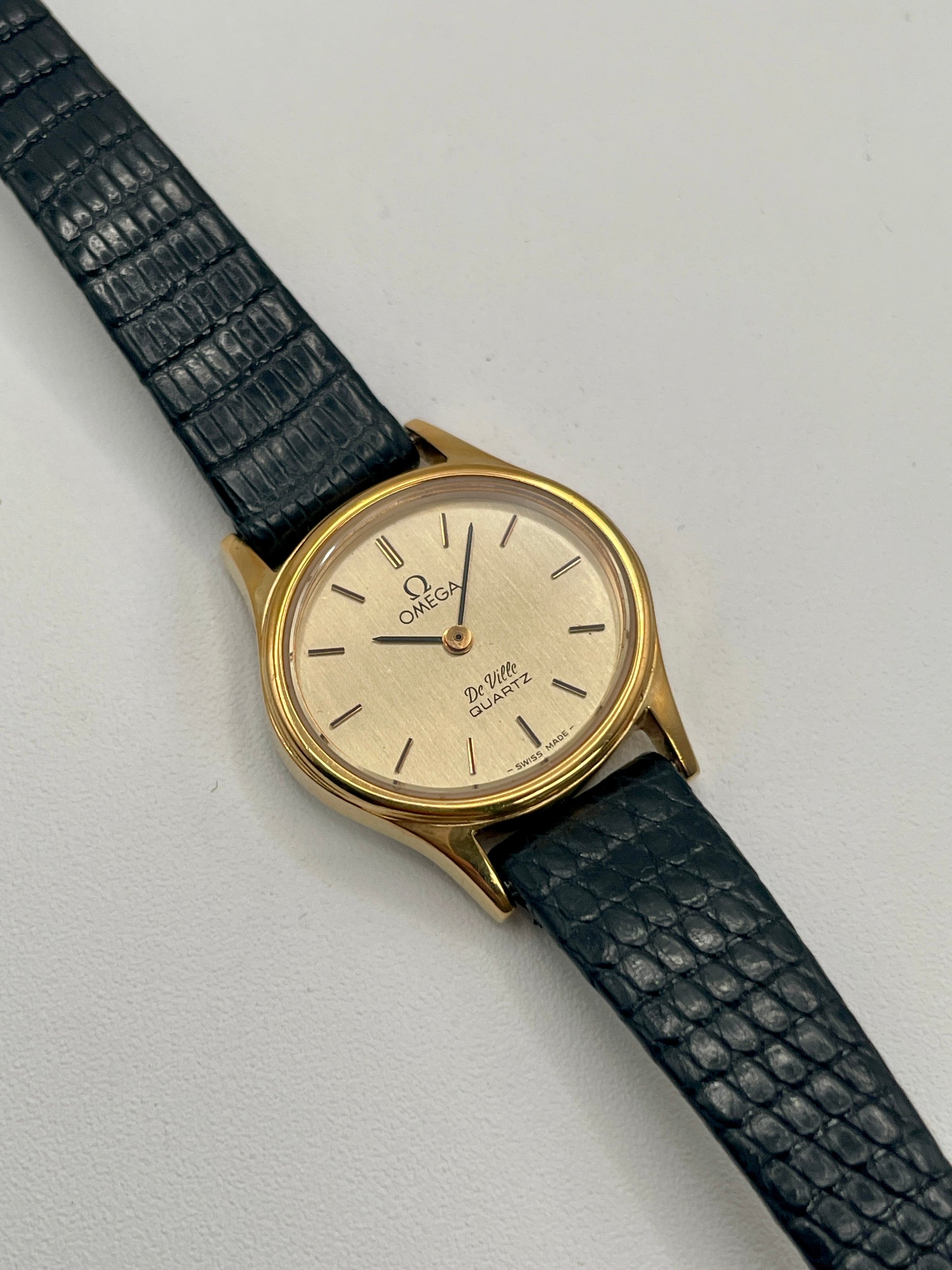 Main view of the Omega De Ville 1350 with champagne dial and minimalist hour markers.
