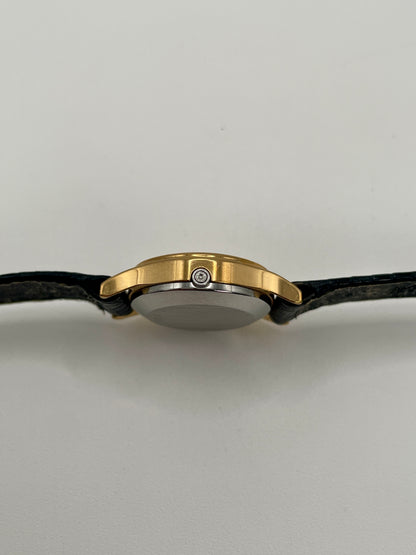 Side view showing the slim case and signed crown of the Omega De Ville 1350.