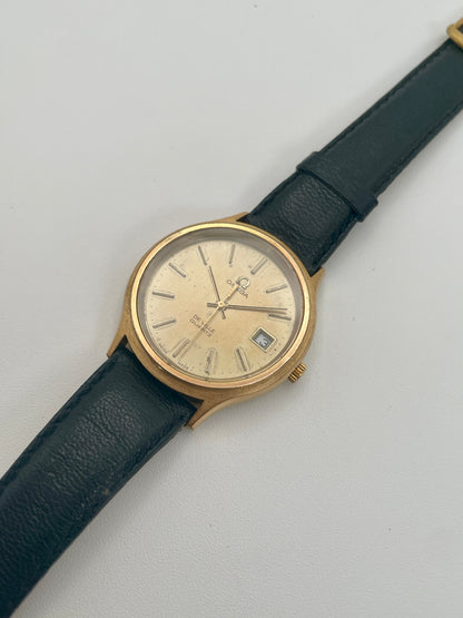 Diagonal angle showing the gold case and cream dial of the Omega De Ville 192.0033
