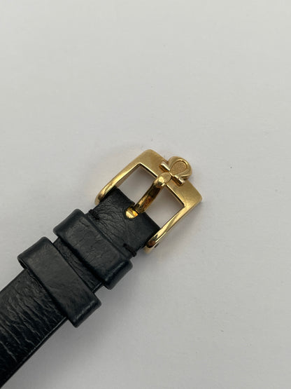 Close-up view of Omega De Ville TV Dial watch buckle with black leather strap.