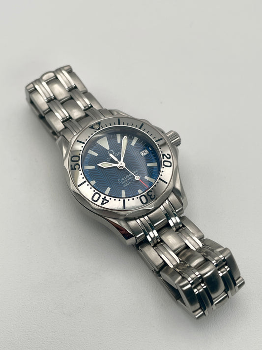 Omega Seamaster 300M 2285.80 Ladies Watch with a stainless steel case and bracelet, front view showing blue wave-pattern dial and bezel.