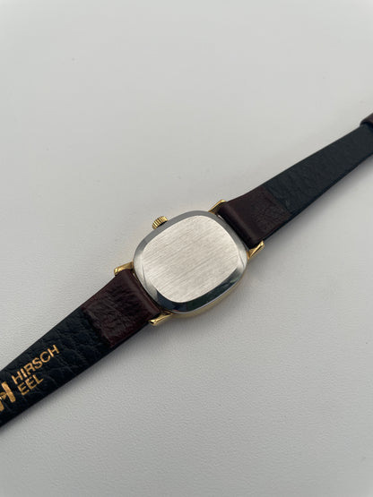 Caseback view of the Omega De Ville 511.0509 watch, featuring a brushed metal back and leather strap.