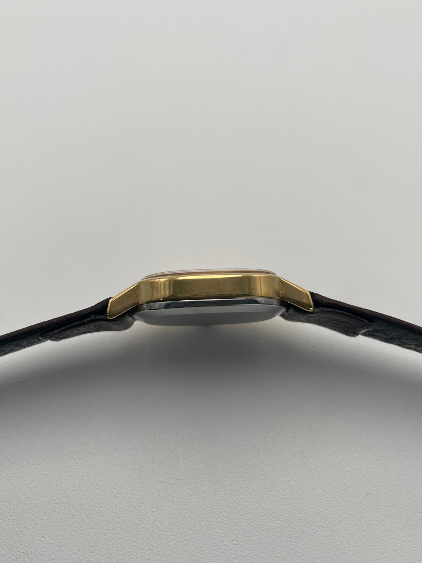 Side view of the Omega De Ville 511.0509 watch, showing the thin profile.