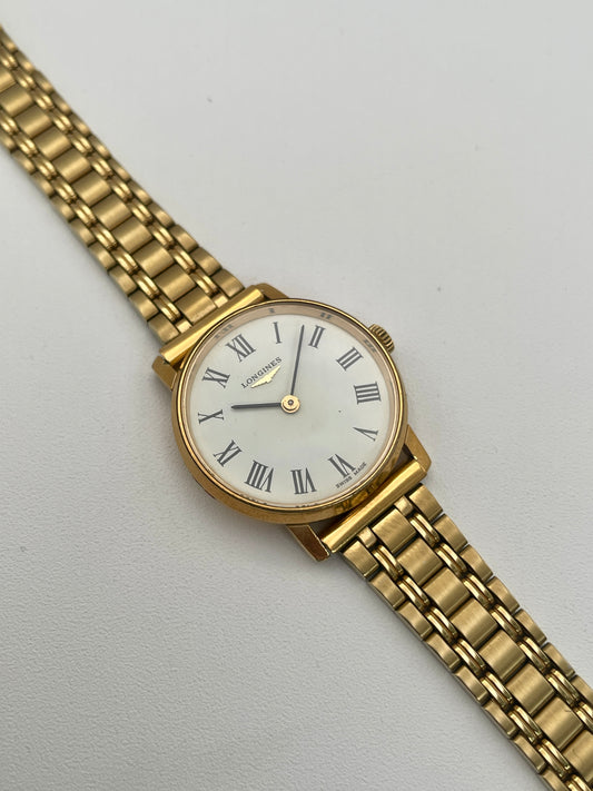 Longines Classic Vintage Ladies Watch in Gold with a white dial, black Roman numerals, and a gold-tone link bracelet, main view.