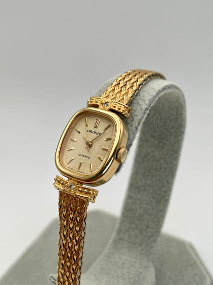 Diagonal right-side view of Orient Vintage Women's Watch showcasing its champagne dial and detailed lugs.