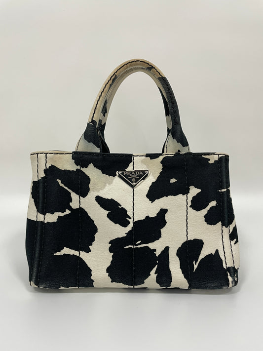 Front view of the Prada Canapa St. Caval handbag in black and white canvas.
