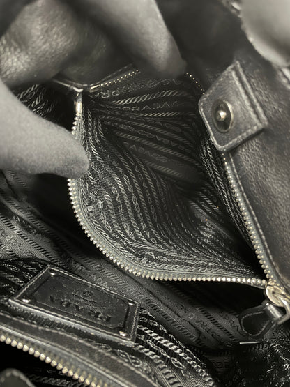 Interior view of the Prada Tessuto Ruffle Bag in black nylon, showcasing its inner zipper pocket.