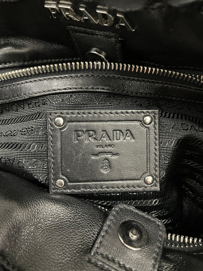 Close-up of the Prada logo on the interior of the Tessuto Ruffle Bag in black nylon with a branded lining.