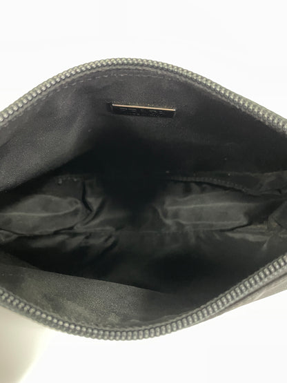 Interior view of a Prada Tessuto Spazzolato bag in indigo prune nylon showcasing the spacious black fabric lining.