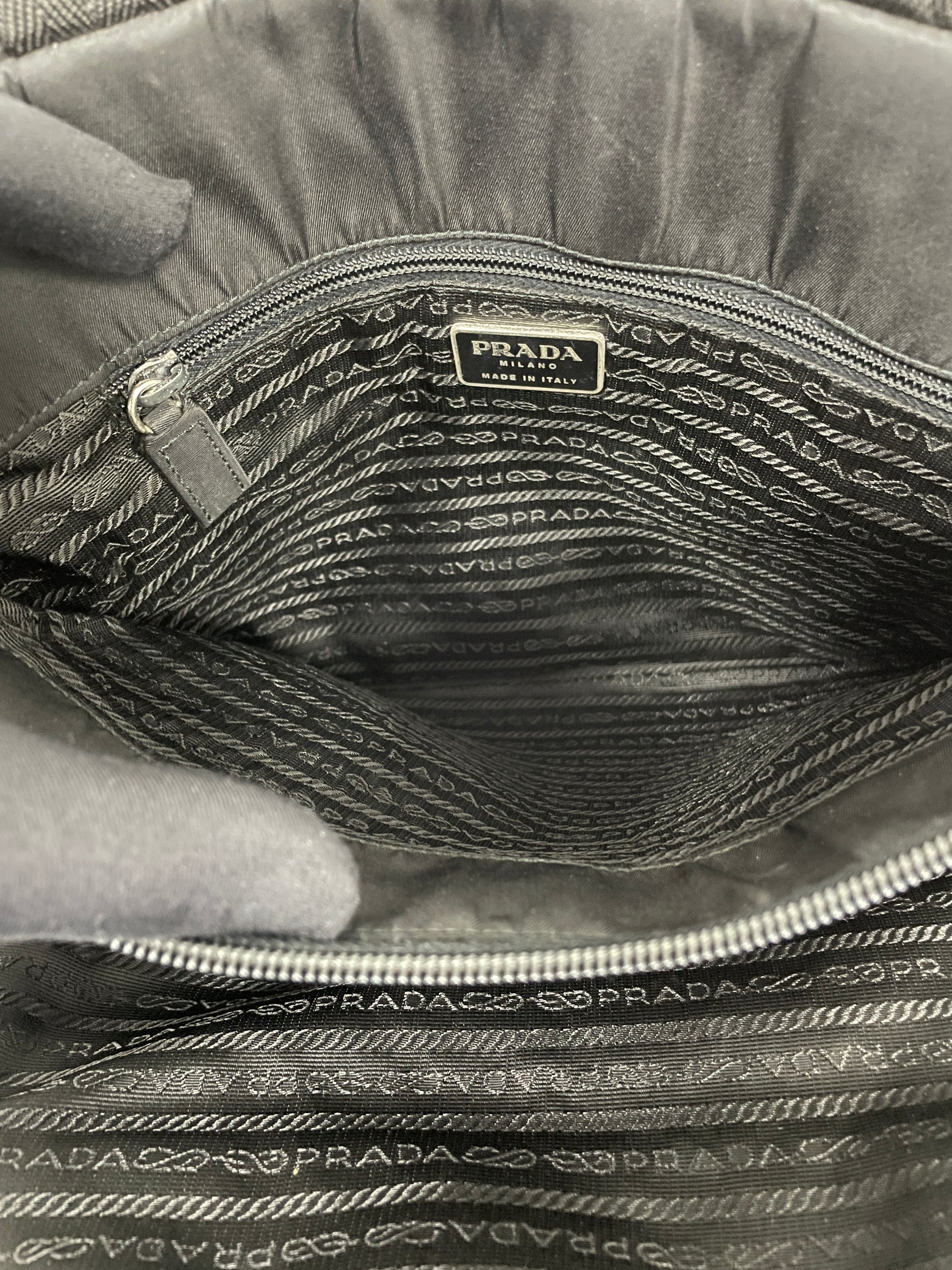 Full interior view of the Prada Tessuto Tote Bag in black nylon, showcasing the spacious compartment and branded lining.