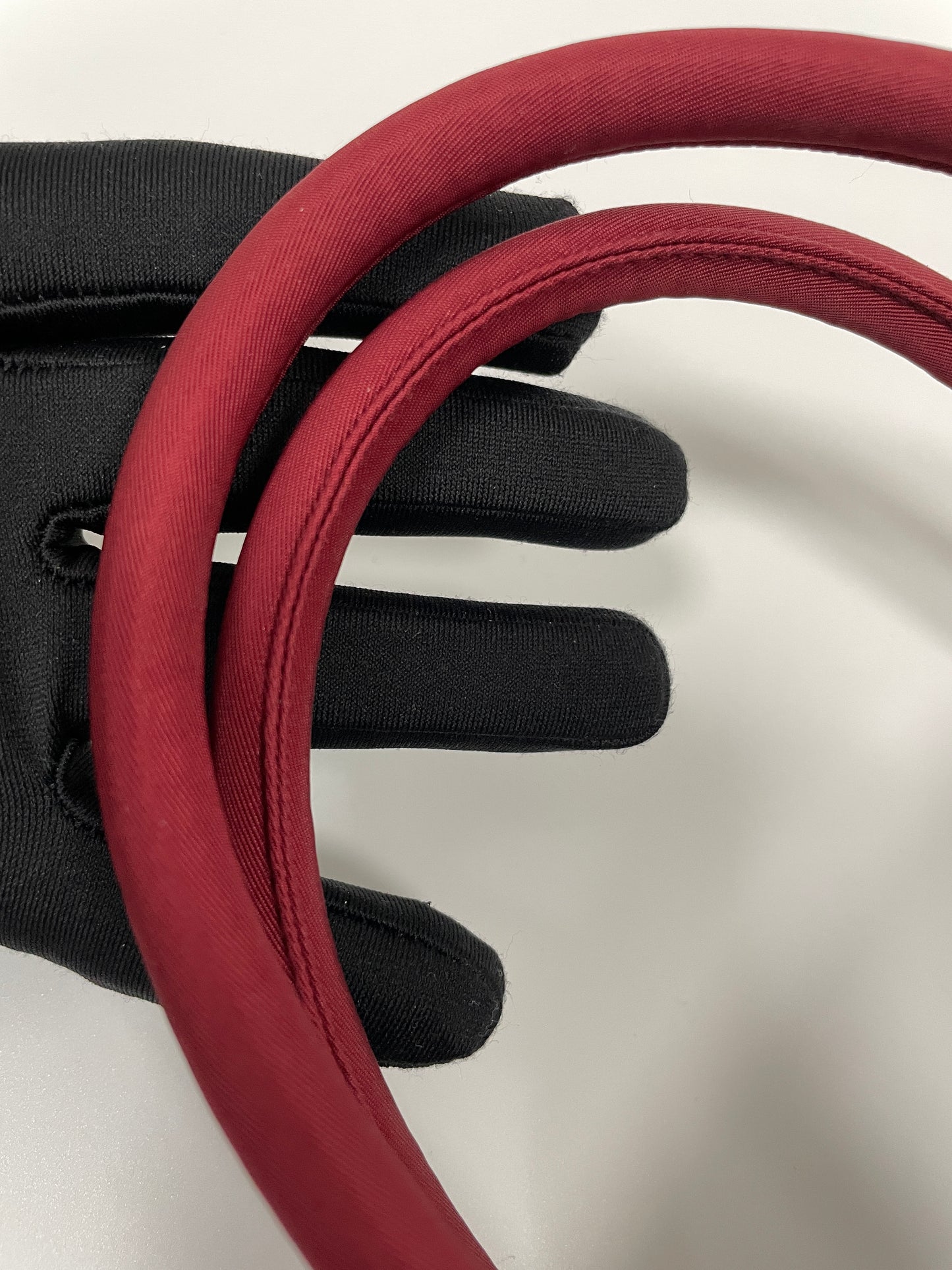 Close-up view of the handles and stitching details on the Prada Tessuto Tote Bag in red nylon.