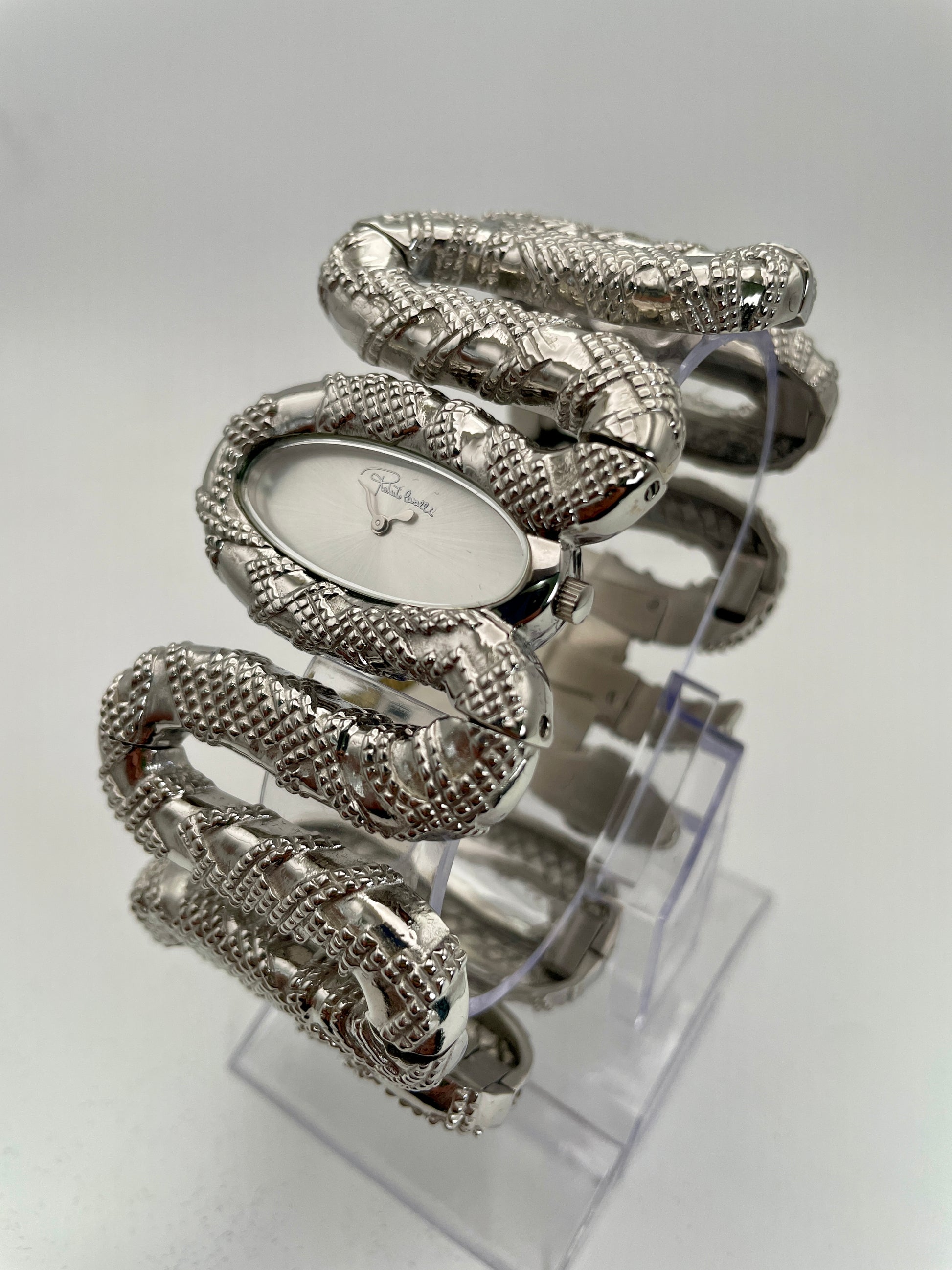 Diagonal view of Roberto Cavalli Snake Bangle watch, highlighting the detailed snake pattern in silver.