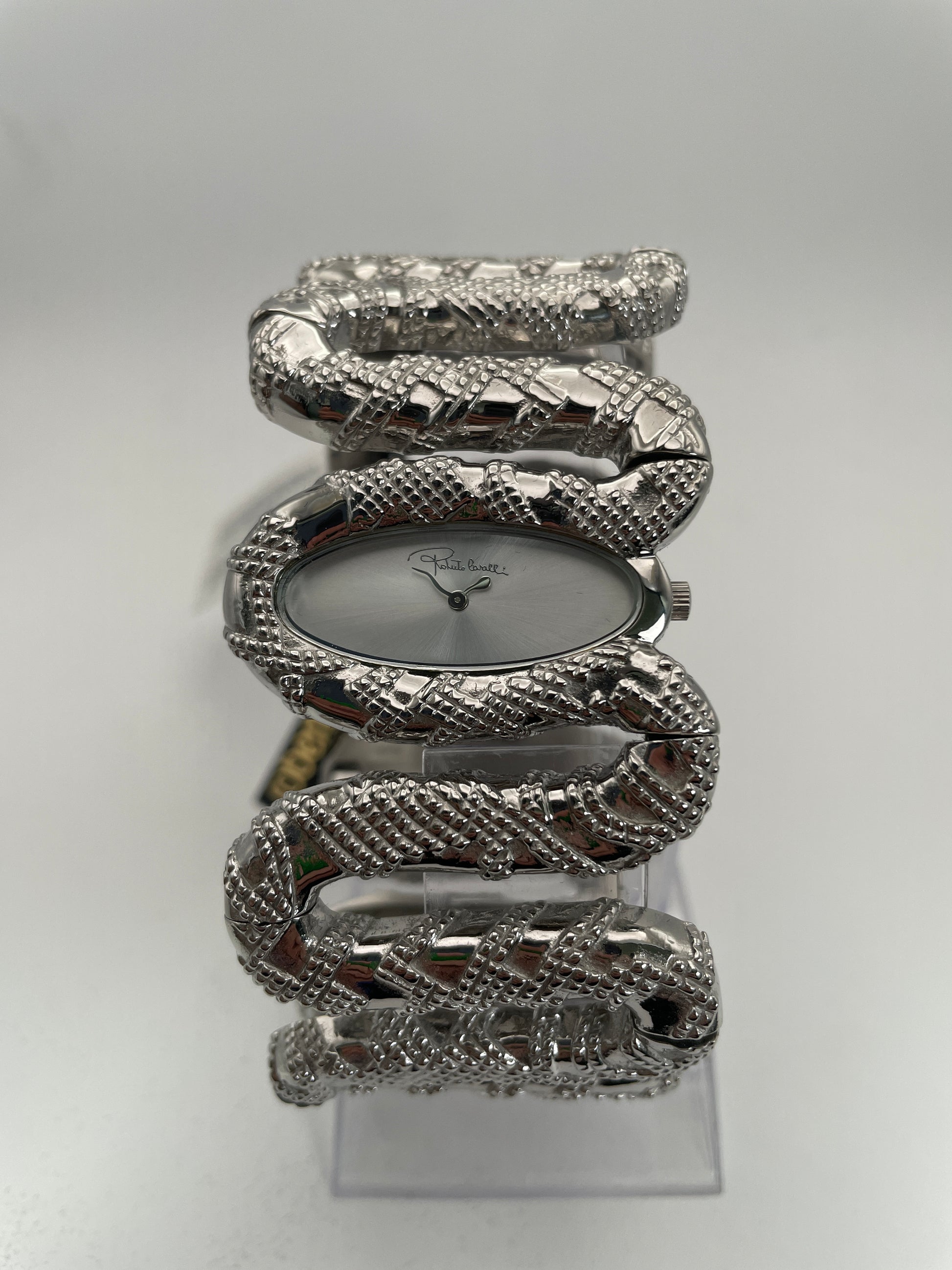 Front view of Roberto Cavalli Snake Bangle watch with a silver snake bracelet and silver dial.