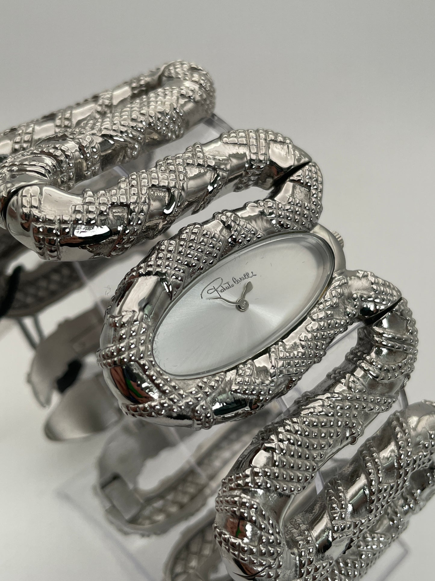 Main view of Roberto Cavalli Snake Bangle watch in a box, showing intricate snake design in silver.