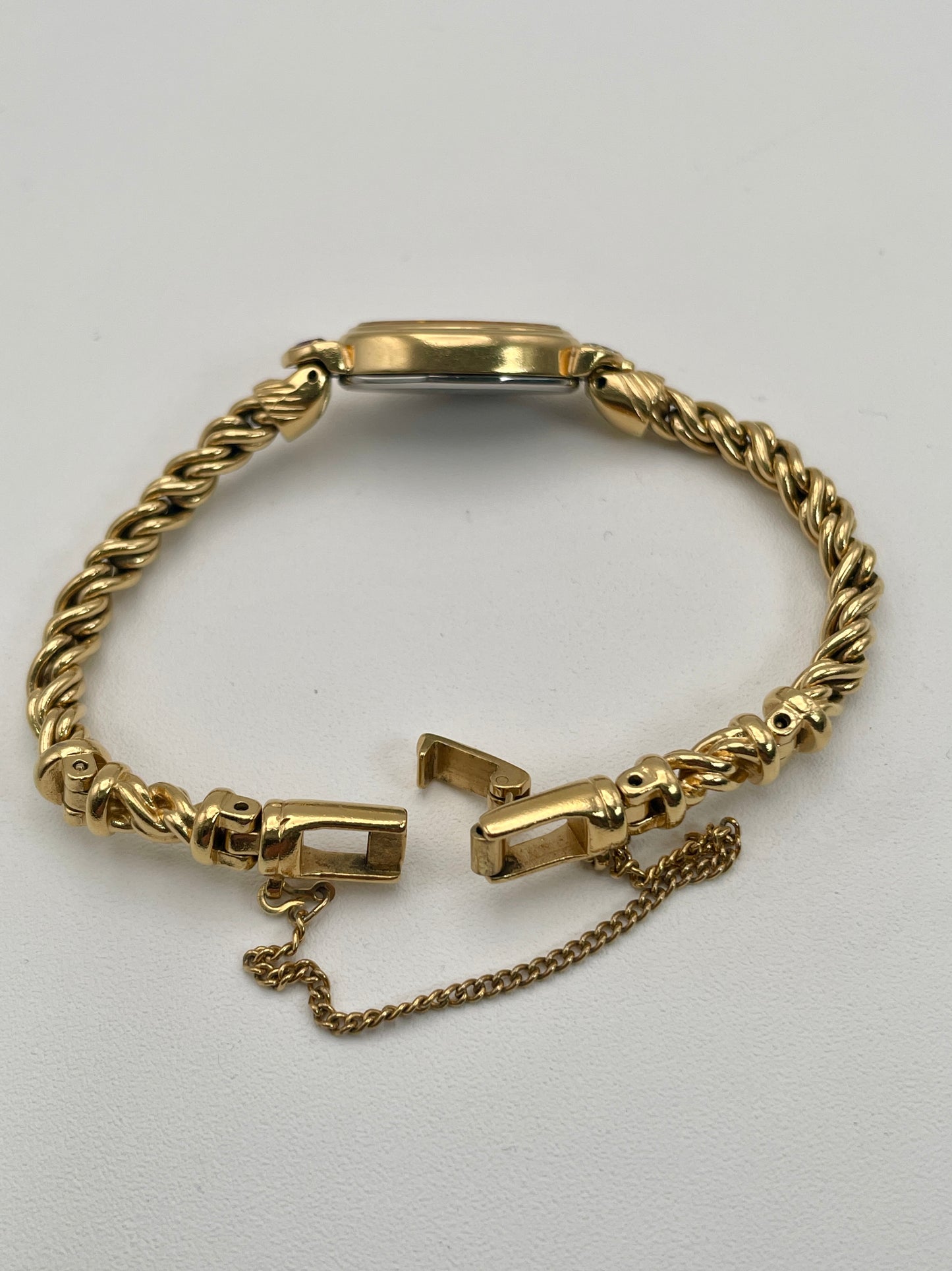 View of open clasp on Seiko 1E20-5760 vintage women's gold watch.