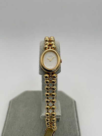 Alternate front view of Seiko Alba Y588-5180 vintage gold women's watch showing oval case and white dial.
