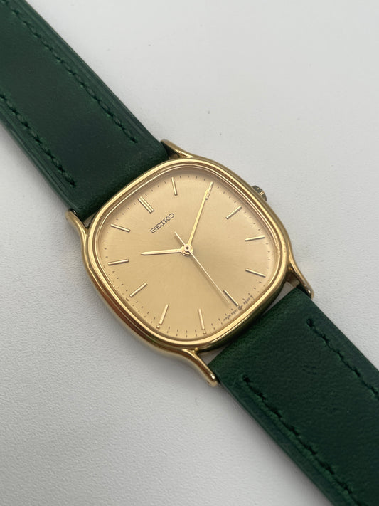 Image and view of Seiko Chariot in gold-tone with green leather strap