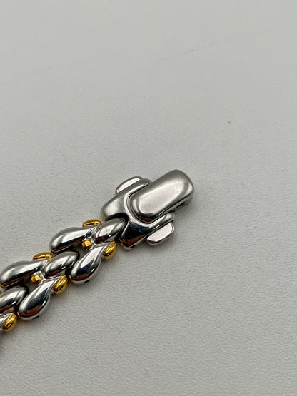 Close-up of the polished clasp with two-tone finish
