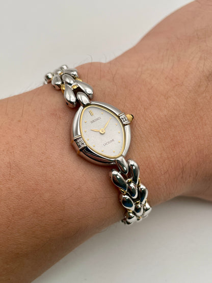 Wrist shot showing the Seiko Exceline watch worn, highlighting its slim profile and elegant bracelet
