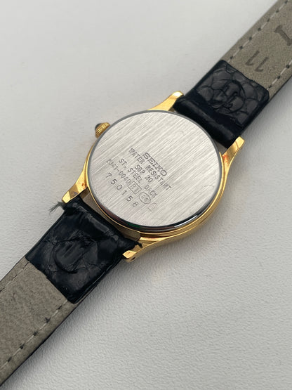 Caseback of Seiko Exceline gold watch, showing stainless steel back with markings.