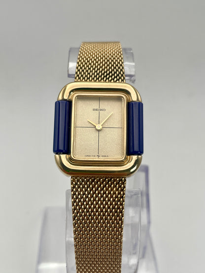 Front view of Seiko Hidden Crown 1719-3070 vintage ladies' watch in gold with a blue and champagne dial.