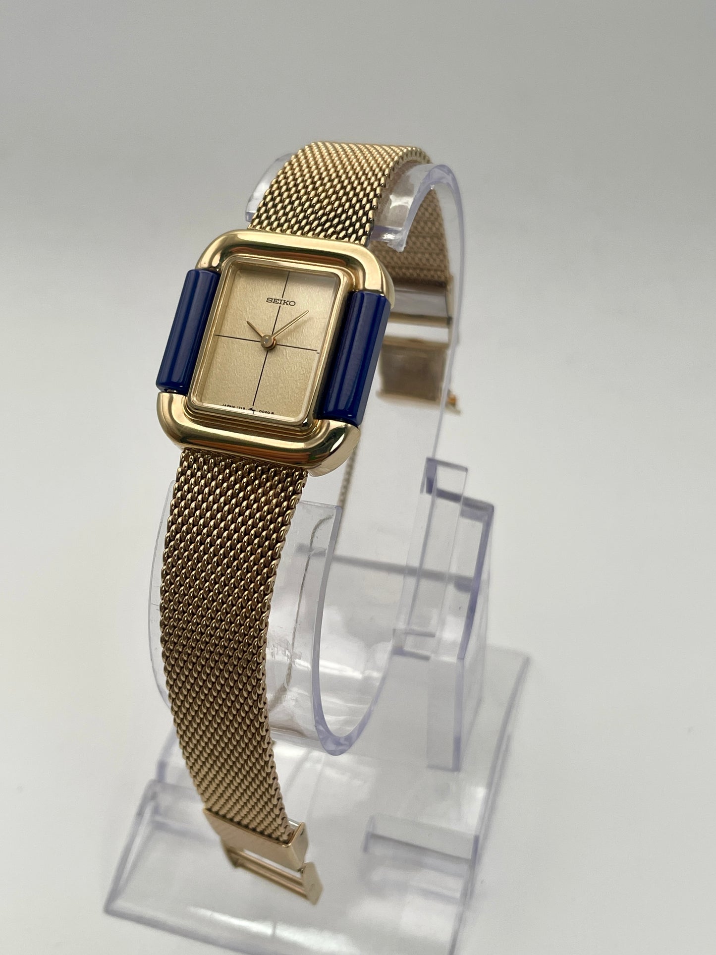 Upright front view of Seiko Hidden Crown 1719-3070 ladies' watch with mesh bracelet and minimalist champagne dial.