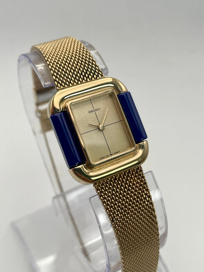 Main view of Seiko Hidden Crown 1719-3070 vintage ladies' watch in gold with a blue and champagne bezel.